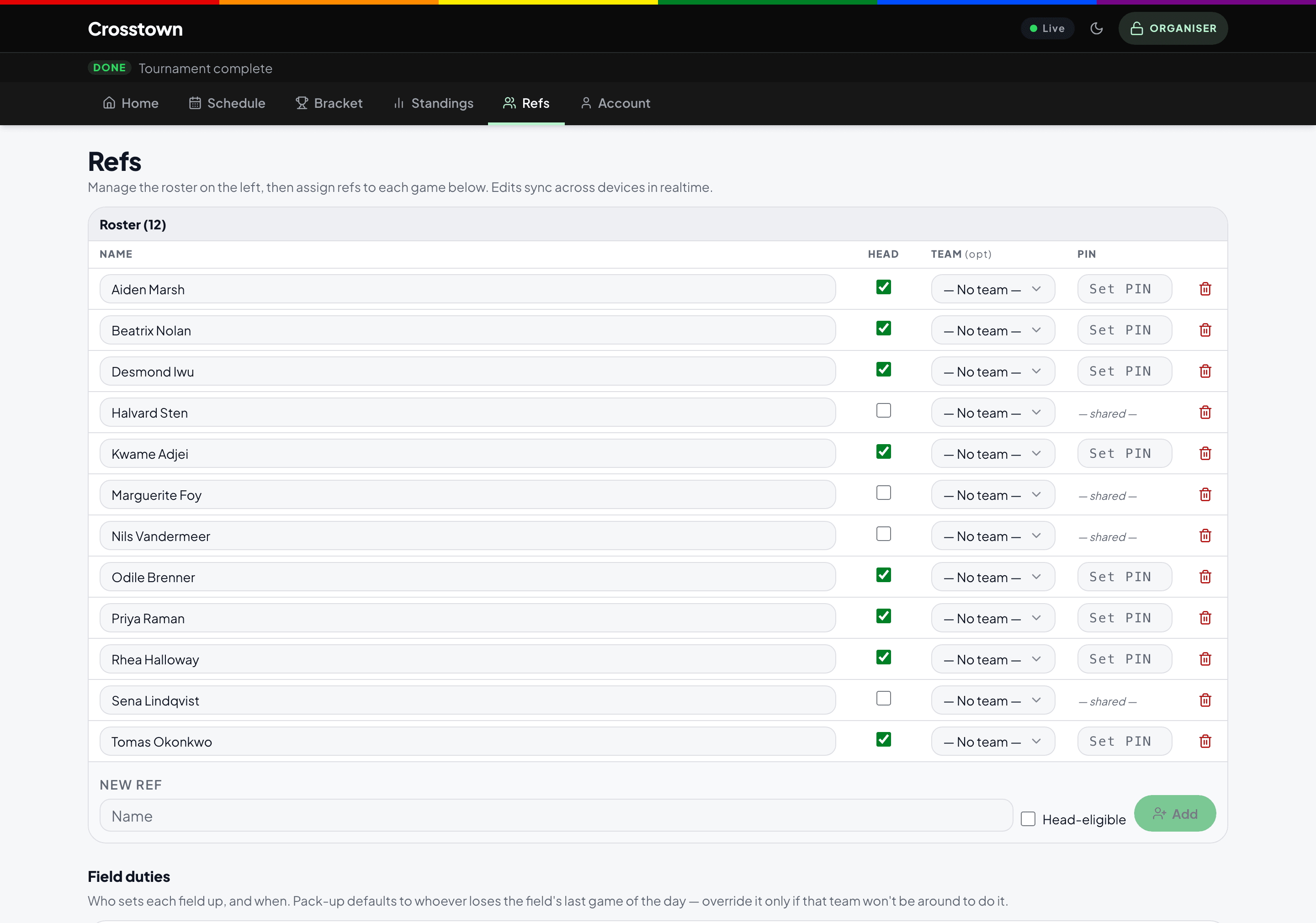 The tournament site in organiser mode: the same header and navigation as the public view, with an ORGANISER badge in place of the sign-in control and an extra tab that is hidden for everyone else. The panel below manages a roster of officials, marks who is eligible to lead a game, and sets a per-person PIN.